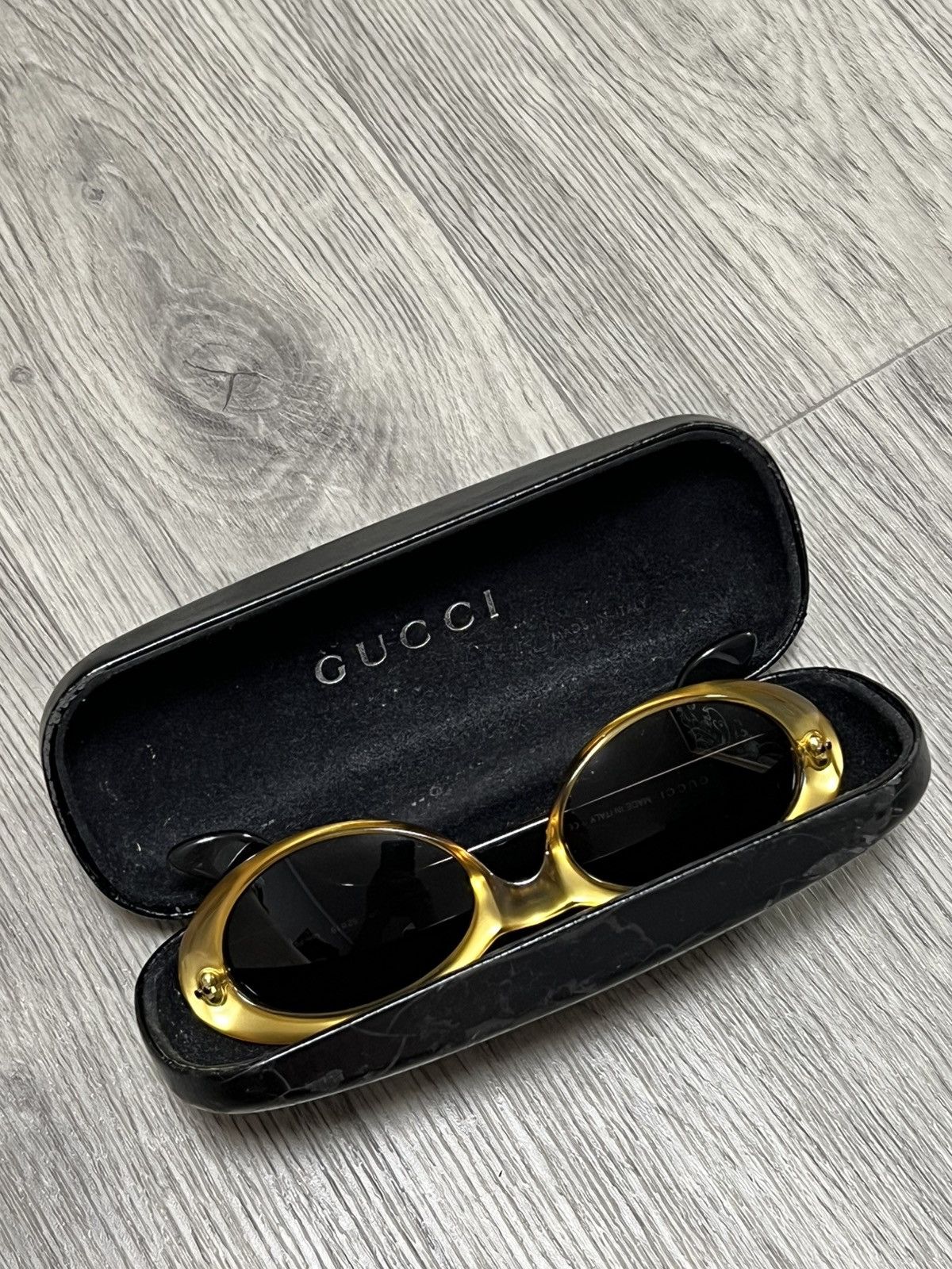 Gucci Vintage gold sunglasses with black inner temples