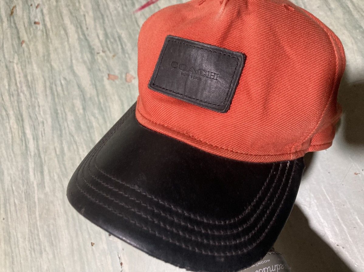 image of Vintage Hats Coach Genuine Leather Cap in Orange/Black, Men's