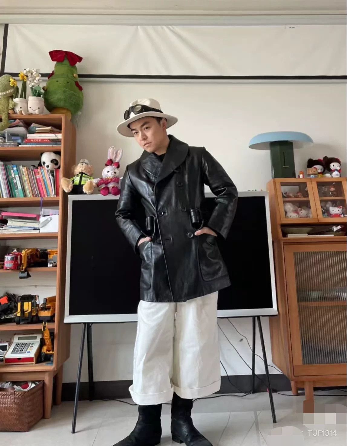 black double-breasted leather coat