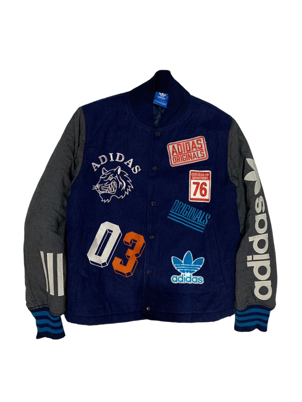 Adidas originals badge varsity jacket online