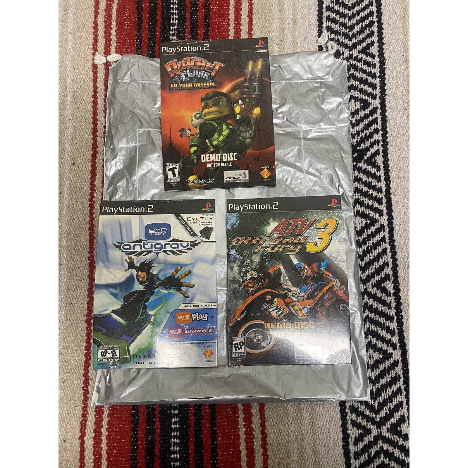 image of Sony Ps2 Demo Discs Lot & Bag Ratchet & Clank Antigray Atv Off Ro in Grey, Men's