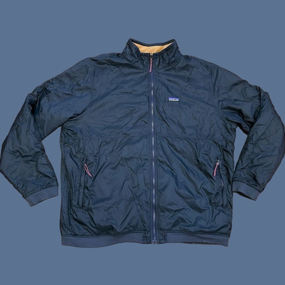 Patagonia Patagonia Reversible Jacket Men Navy Tan XXL Nylon Fleece Zip Zipper Logo Stand Collar Outdoor Casual Long Sleeve Mid-Length 2XL Blue Size US XXL / EU 58 / 5 - 1 Thumbnail