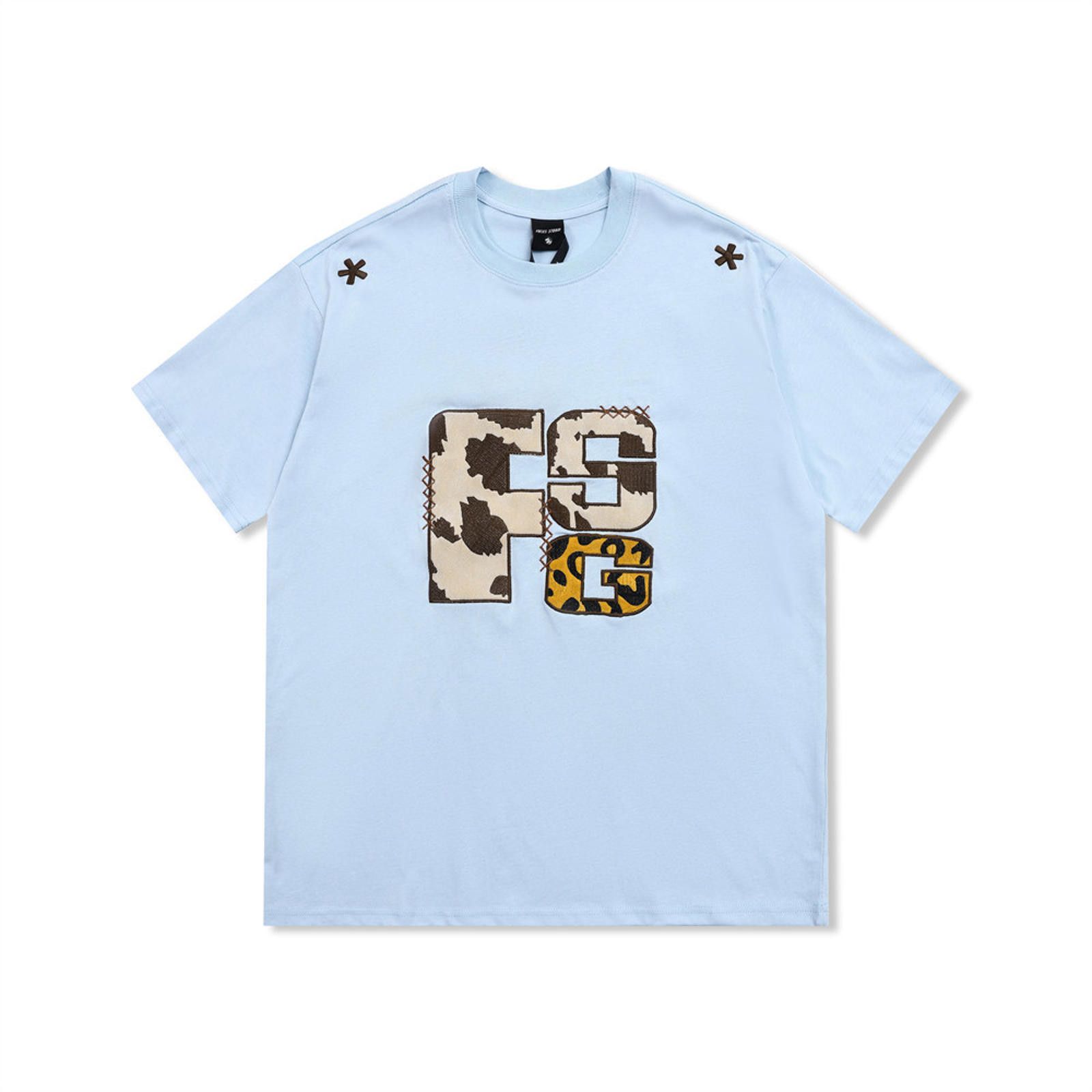 Stylish Light Blue Graphic Tee with Unique Patchwork