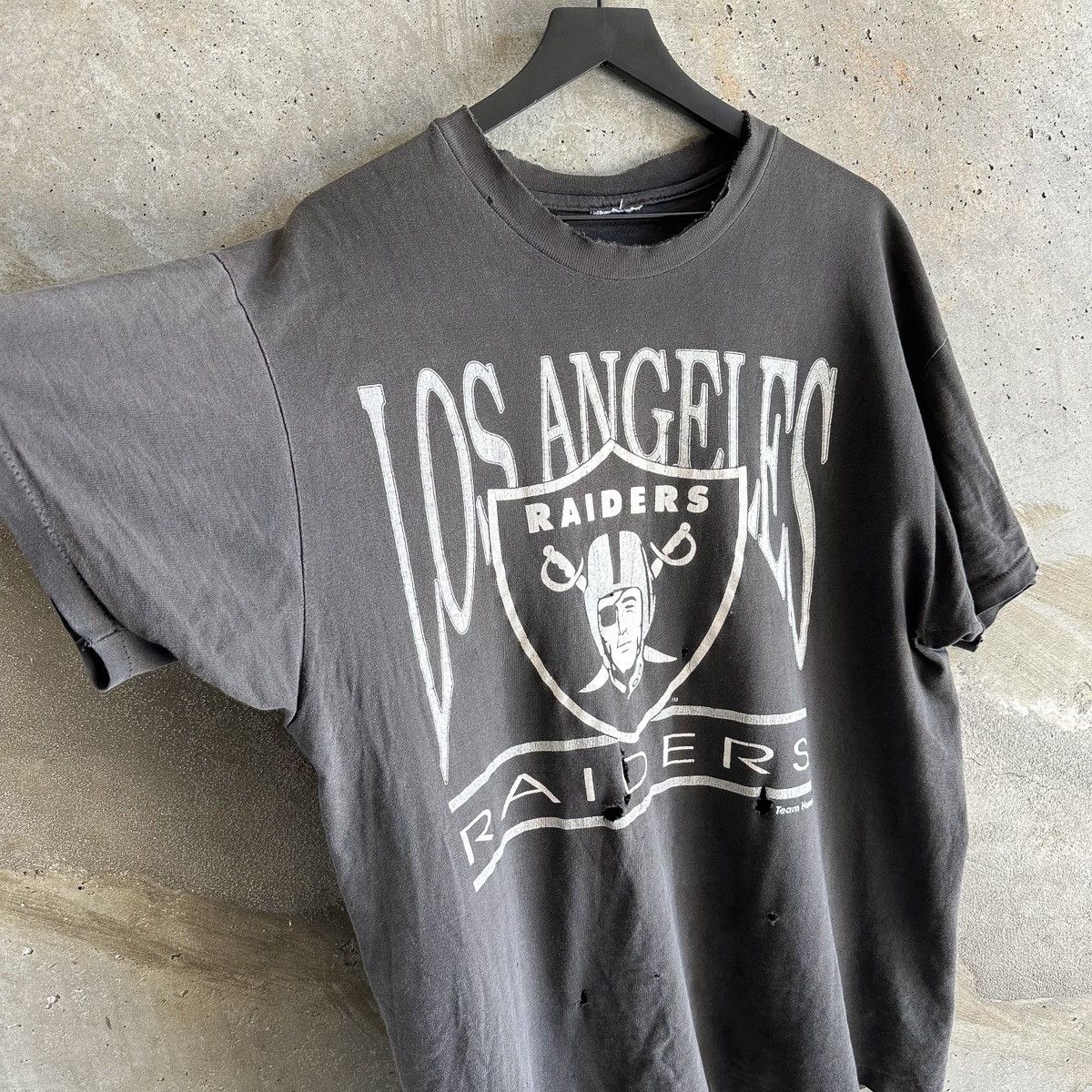 image of Oakland Raiders x Vintage 90’S Thrashed Reversible Raiders T-Shirt in Faded Black, Men's (Size XL)