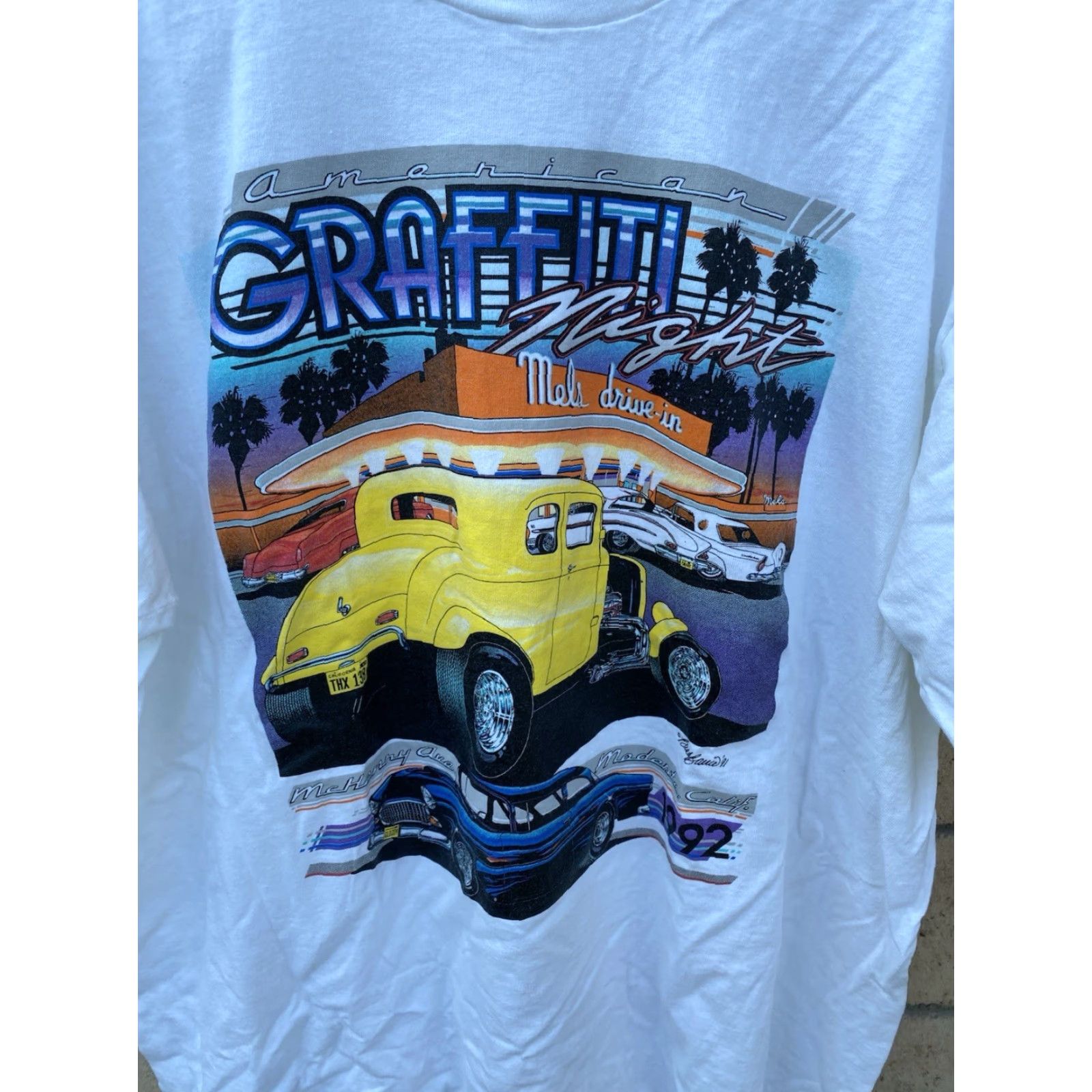 Fruit Of The Loom VINTAGE American Graffiti Night Mels Deive In Modesto 1992 T-Shirt Tee XL White USA 90s Cars City Thread: Fruit of the Loom Men T-Shirt Size US XL / EU 56 / 4 - 3 Thumbnail