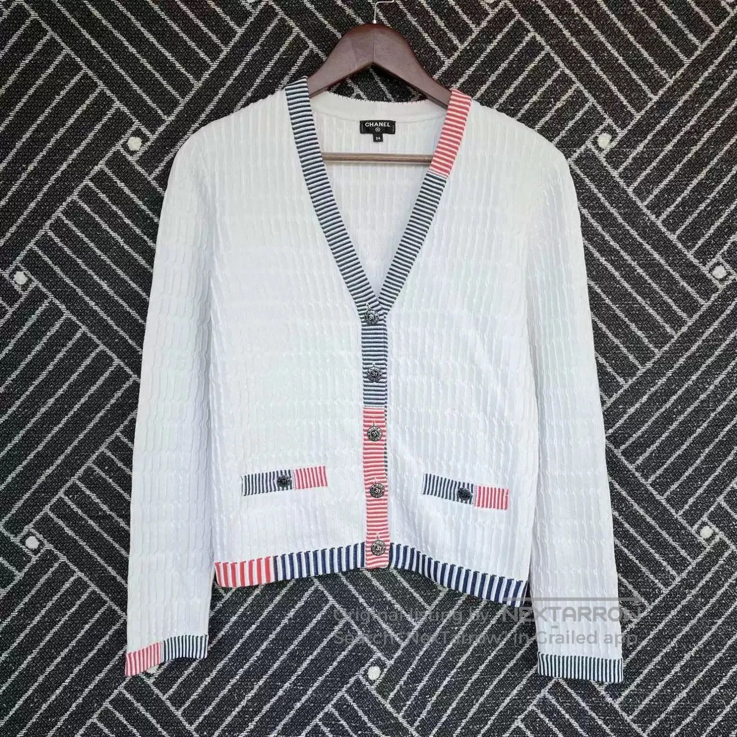 white striped knit cardigan by Chanel.