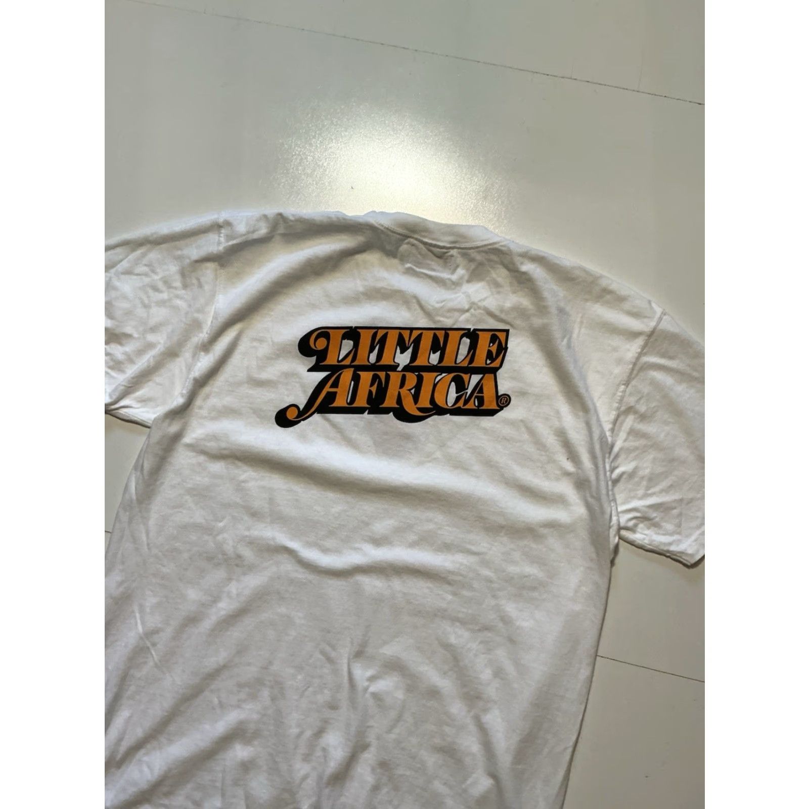 Vintage Little Africa Soul Made Global LA Graphic White Crewneck S/S T-Shirt Sz. L Mens Crew Neck T-Shirt White Graphic 90s? Size US L / EU 52-54 / 3 - 5 Thumbnail