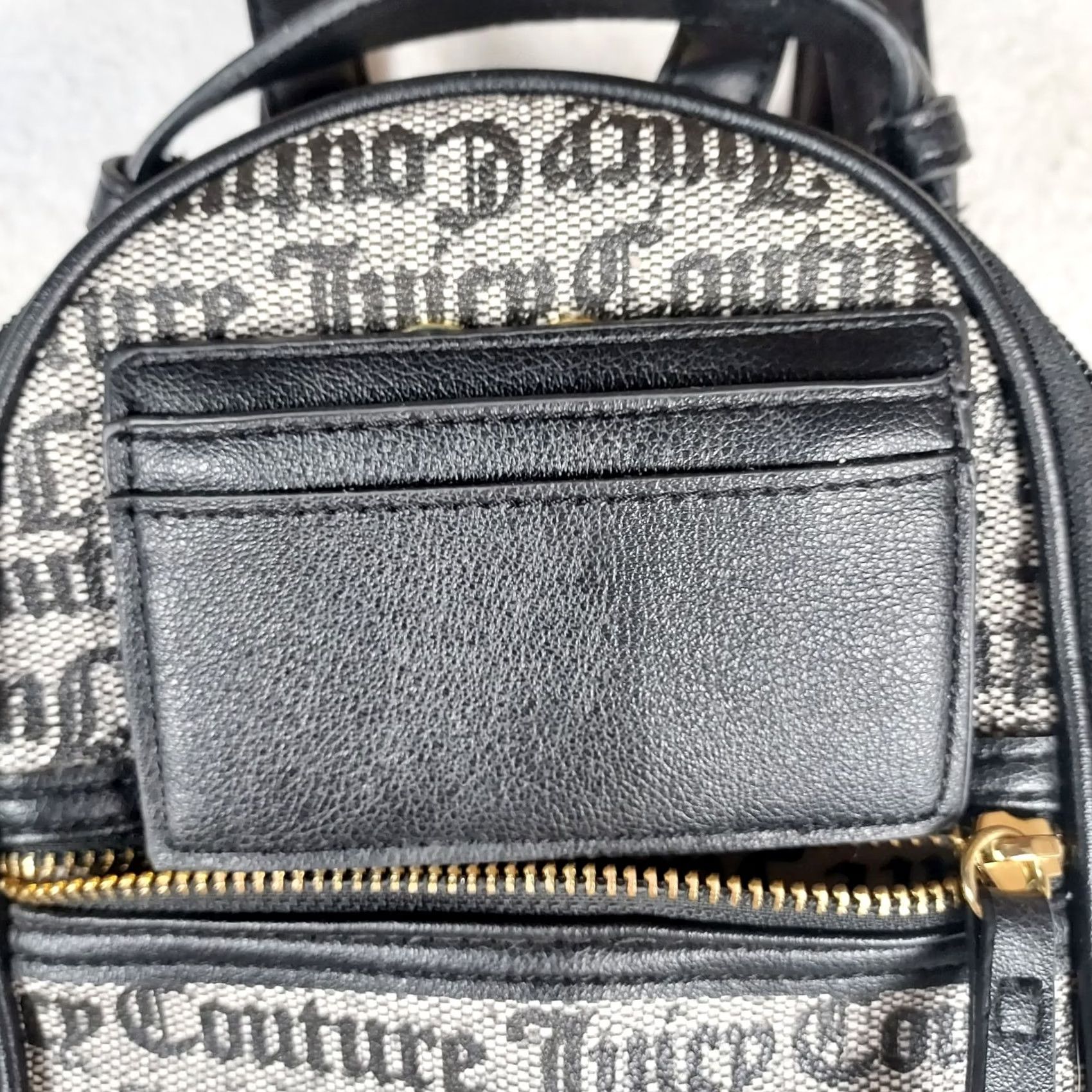 designer black leather backpack silver zippers Grained ~ GIANI shaped zip opens to a roomy interior with a padded laptop sleeve and thoughtfully placed compartments for tech Ever noticed how the right
