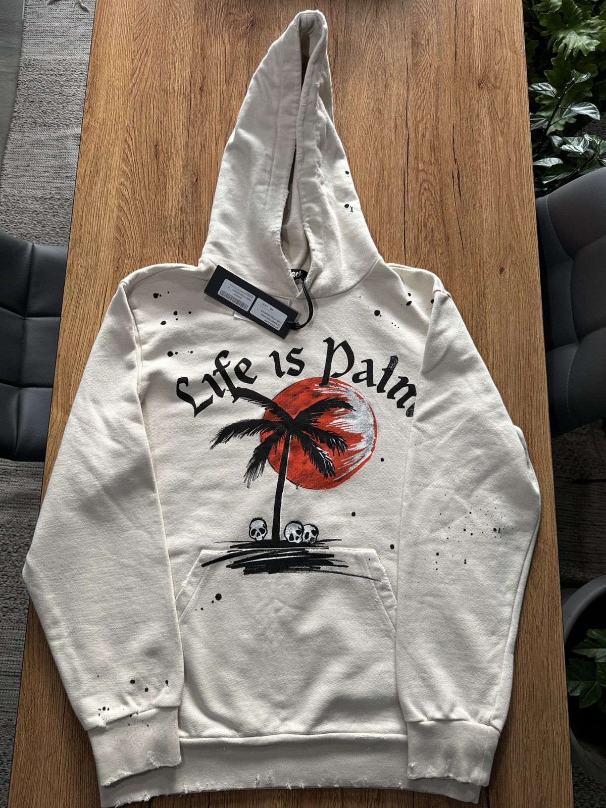 image of Palm Angels Slogan-Print Paint Splatter Hoodie in Beige, Men's (Size Medium)