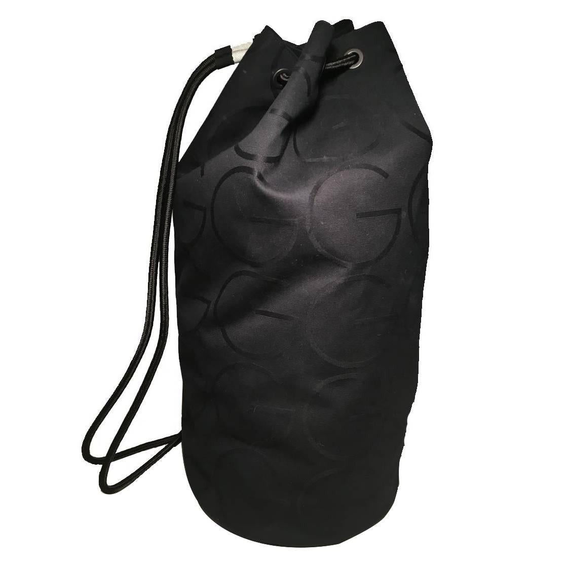 image of Gucci Black GG Monogram Canvas Sling Backpack Bag, Women's
