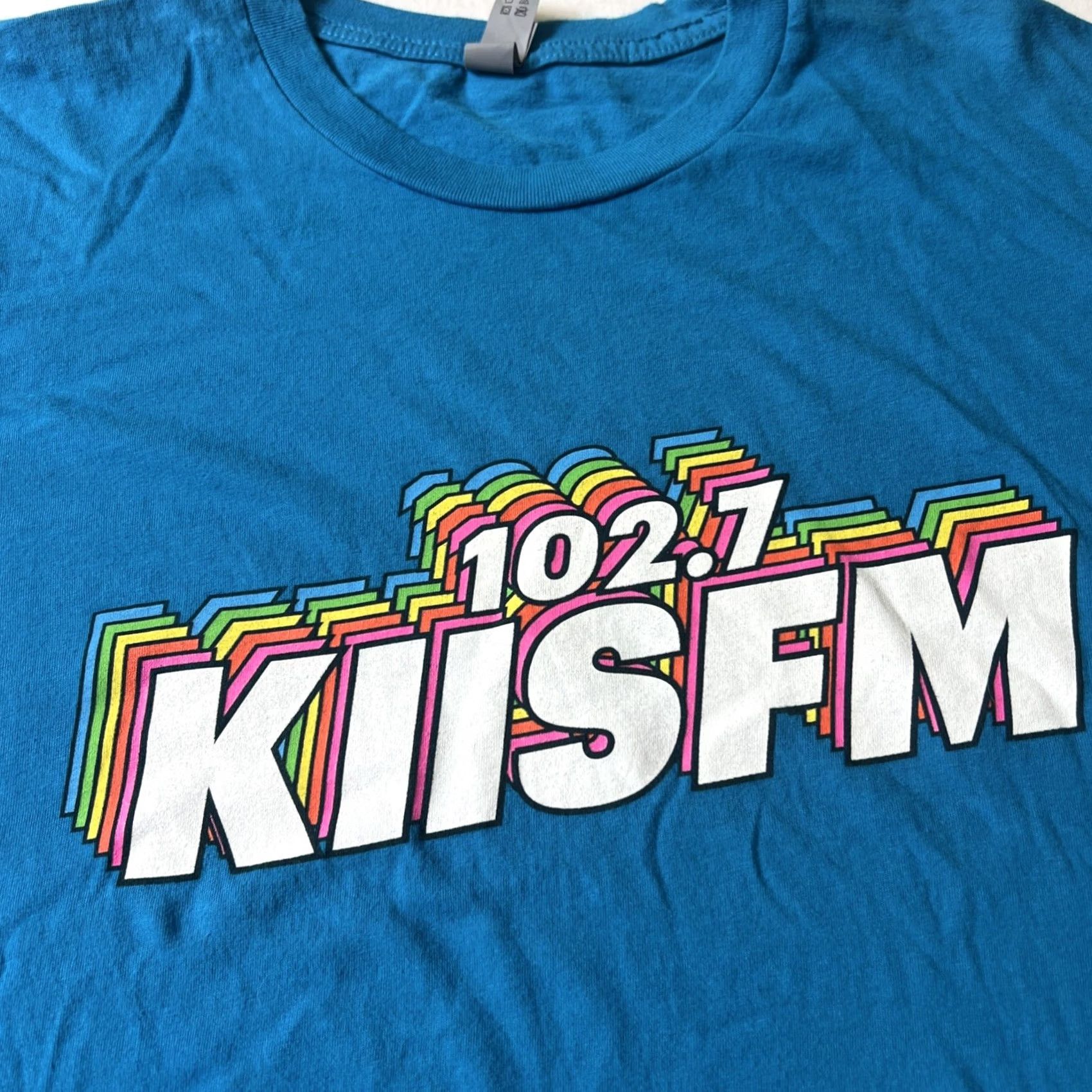Next Level VINTAGE KIIS FM Radio 102.7 Rainbow Logo Shirt XL Blue Next Level Men Short Sleeve Crew Neck Graphic Print Concert/Never Worn Size US XL / EU 56 / 4 - 2 Thumbnail