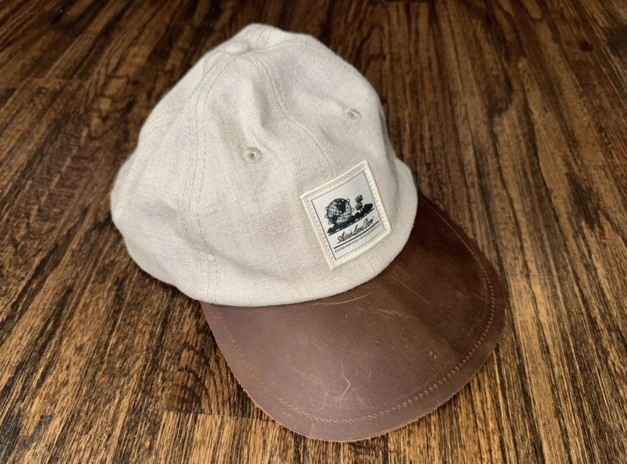 Aime Leon Dore Aime Leon Dore Leather & Linen Unisphere Hat Tan/Brown Cap Size ONE SIZE - 1 Thumbnail