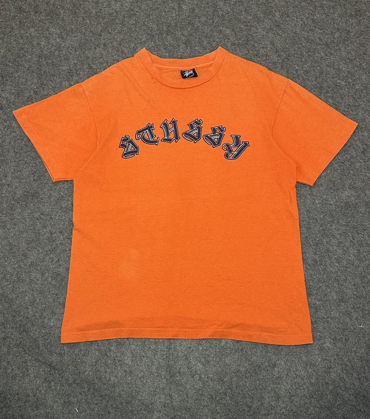 vintage Stüssy t-shirt in orange cotton.