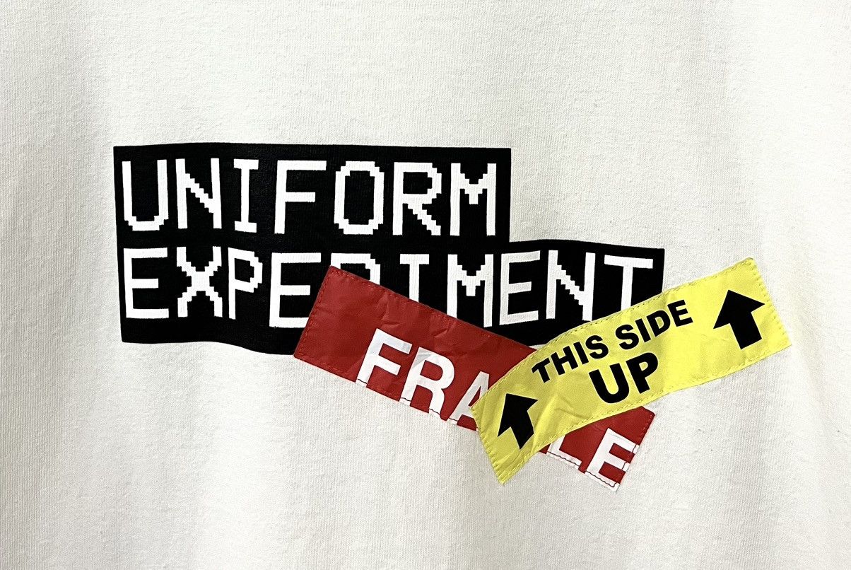 uniform experiment UNIFORM EXPERIMENT SOPHNET ATTENTION TAG JAPANESE TSHIRT Size US M / EU 48-50 / 2 - 3 Thumbnail