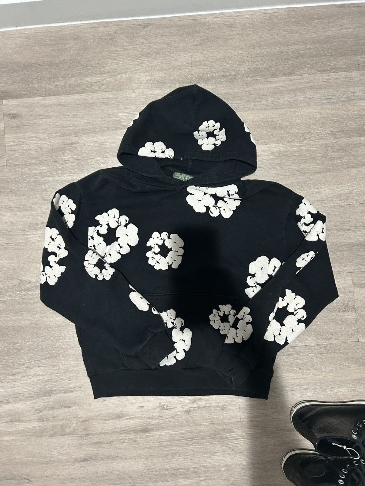 Denim tears black hoodie with the white flowers