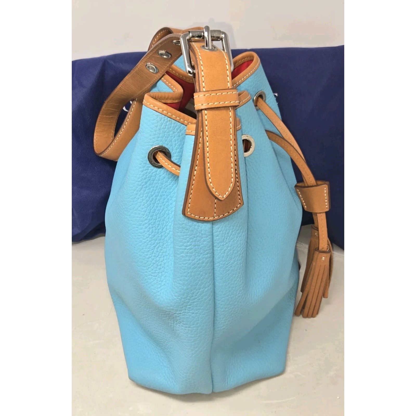 Dooney & Bourke Dooney & Bourke All Weather Leather Drawstring Bucket Bag Turquoise Dust Bag Turquoise Pebble Grain Leather Bucket & Drawstring Bag Womens Size ONE SIZE - 4 Thumbnail