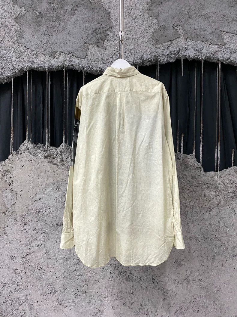 DRIES VAN NOTEN A white long-sleeved shirt coat