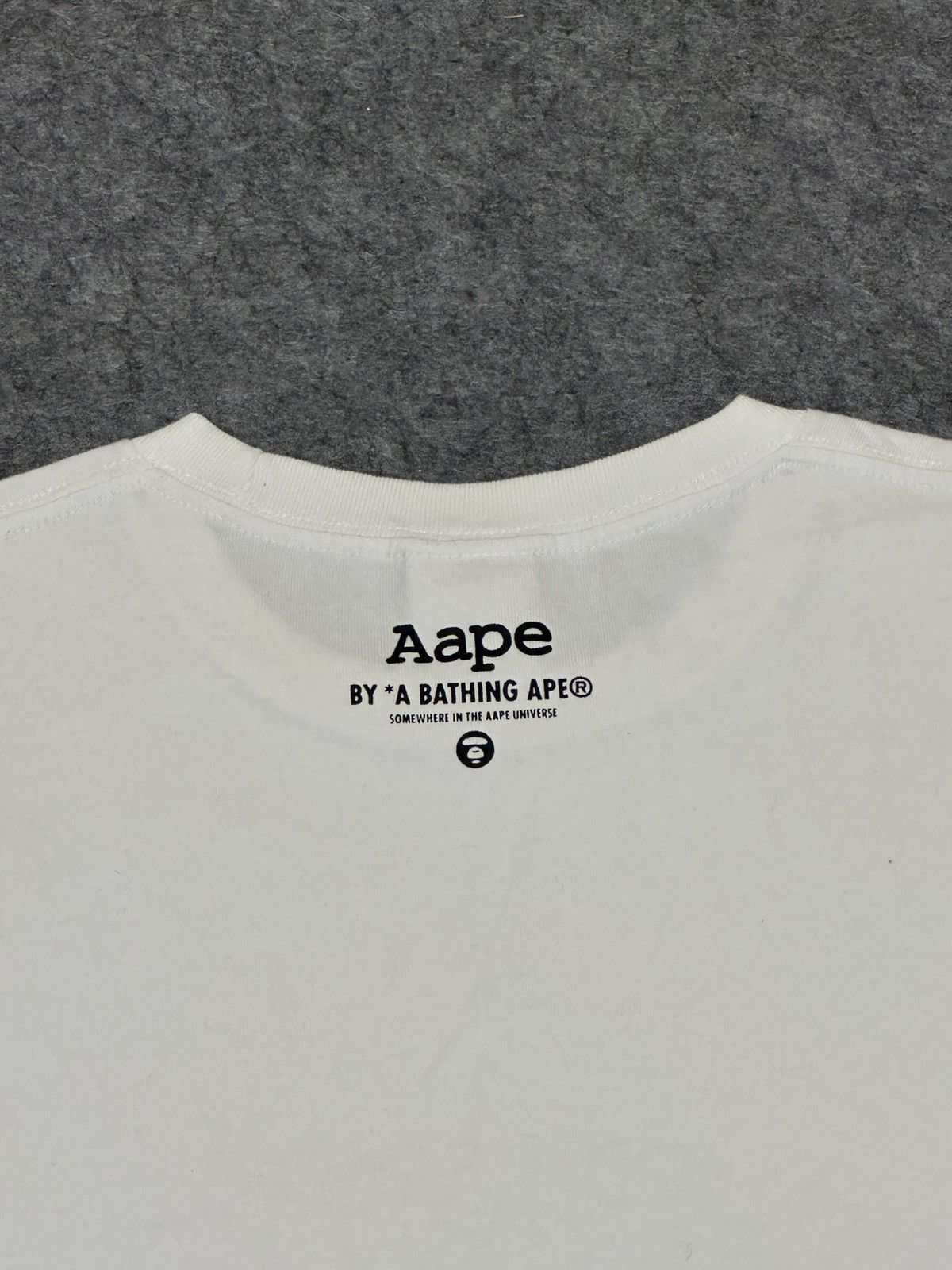 Aape AAPE by A Bathing Ape Moon Face Camo T-shirt in white. Size US M / EU 48-50 / 2 - 4 Thumbnail