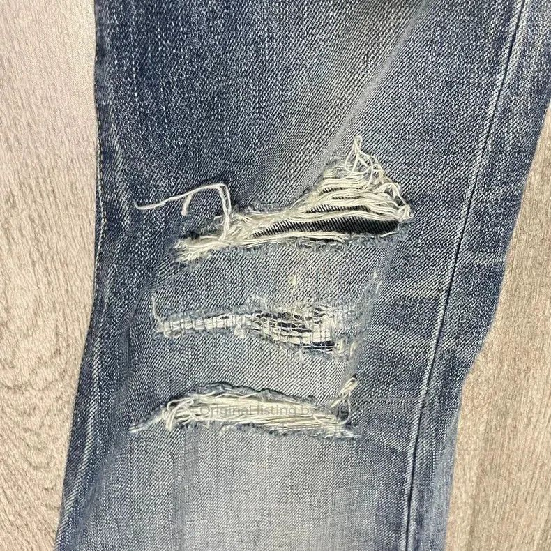 Saint Laurent D02 Distressed Blue Jeans.