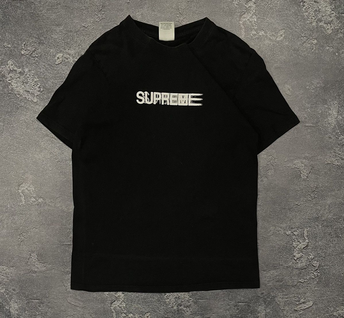 Supreme motion tee online