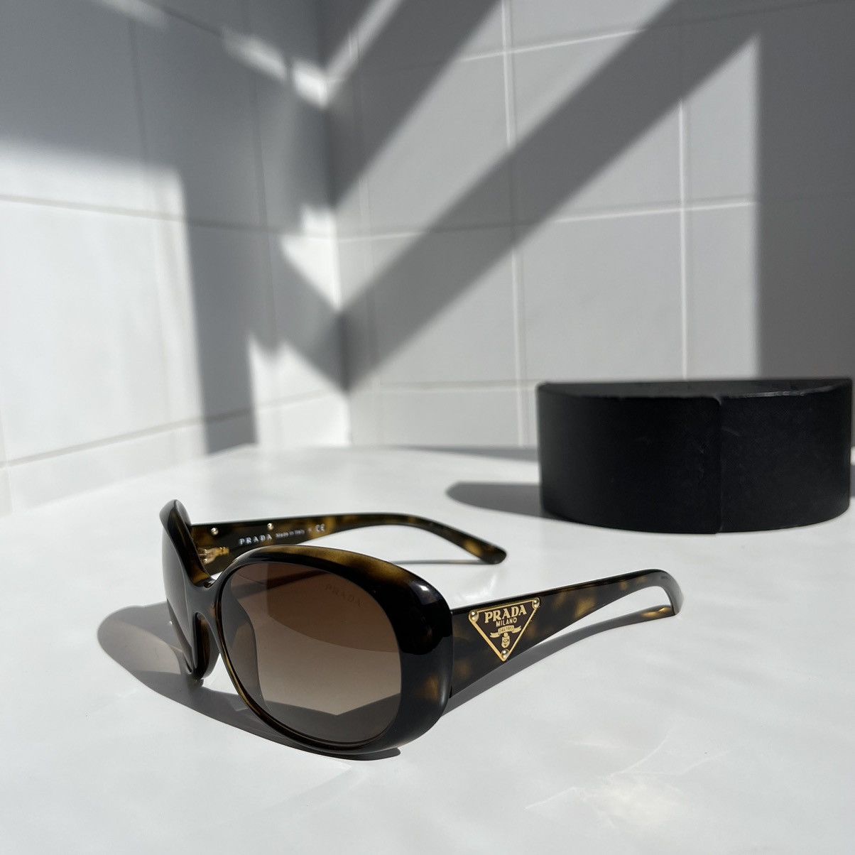 image of Prada Oval Leopard Sunglasses With Prada Triangles Spr 27L, Women's