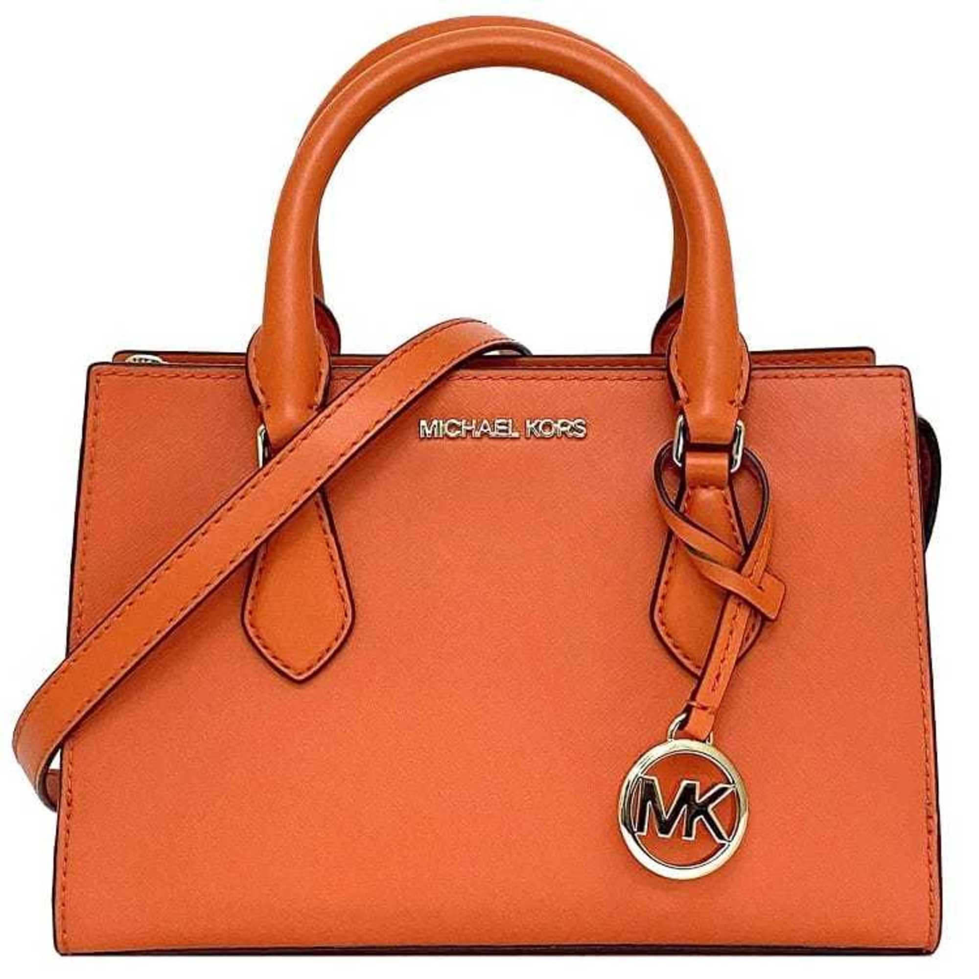Orange and brown michael kors purse hotsell