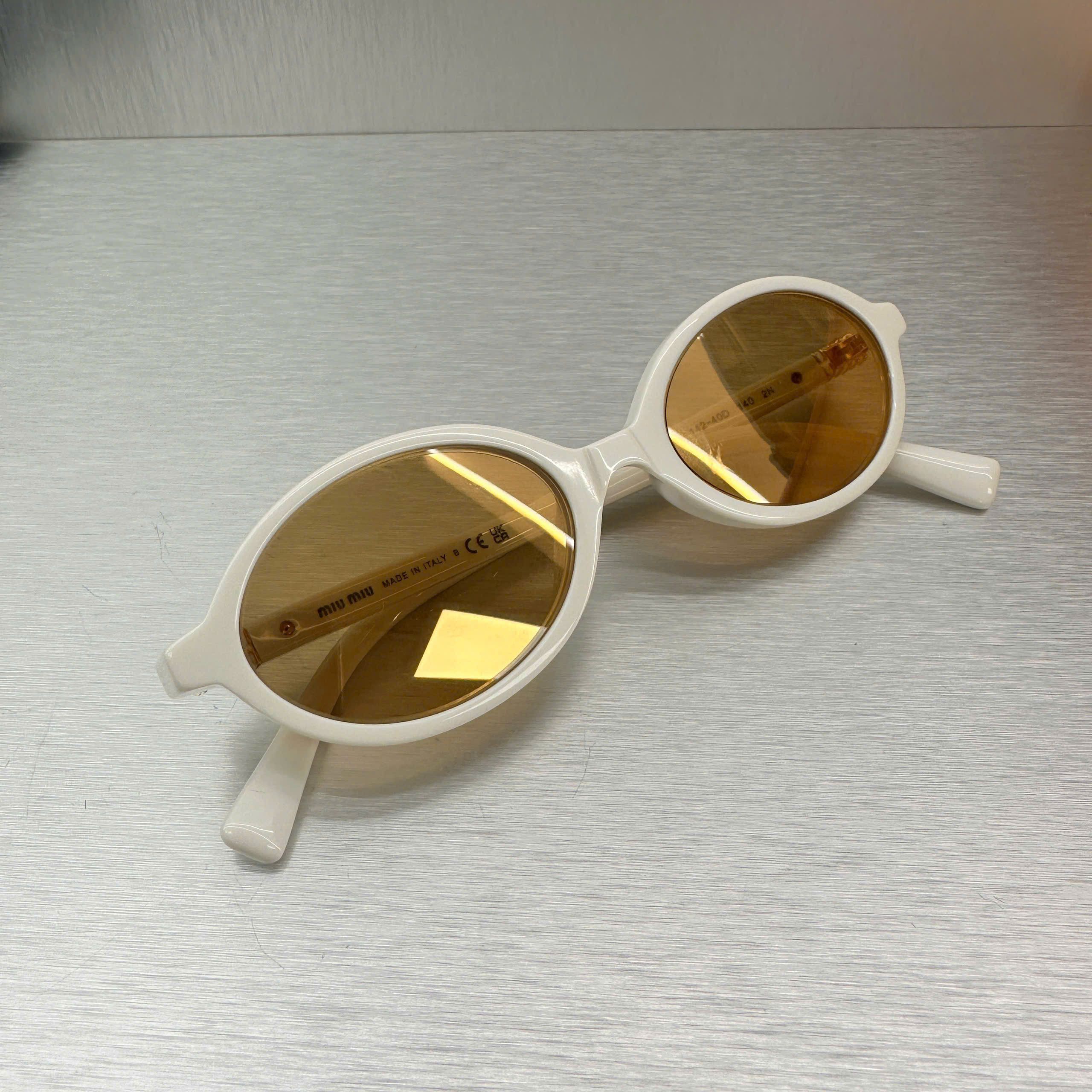 Miu Miu MIU MIU MU 04ZS 14240D Eyewear WHITE Size ONE SIZE - 1 Thumbnail
