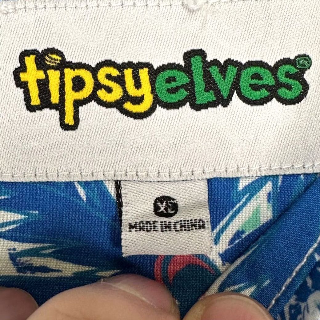 Vintage Tipsy Elves Island Breeze Hawaiian Shirt Adult XL Blue Mens Preppy Geometric Button-Up Short Sleeve Breathable Crowned by: Tipsy Elves Island Breeze Size US XL / EU 56 / 4 - 5 Thumbnail