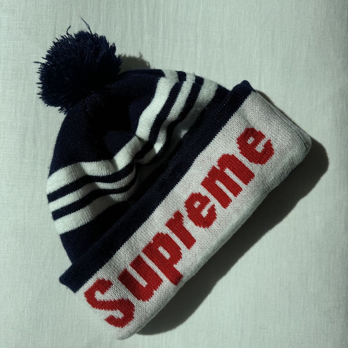 Supreme SUPREME NAVY STRIPE ACRYLIC POM BEANIE W RED LOGO Size ONE SIZE - 9 Thumbnail