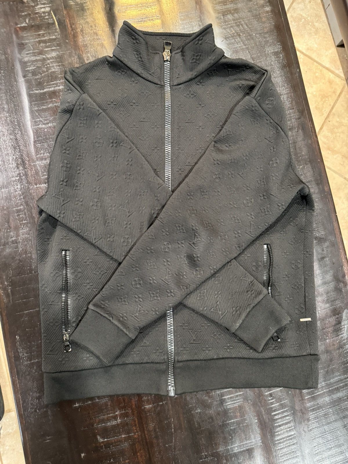 Louis Vuitton monogram embossed track