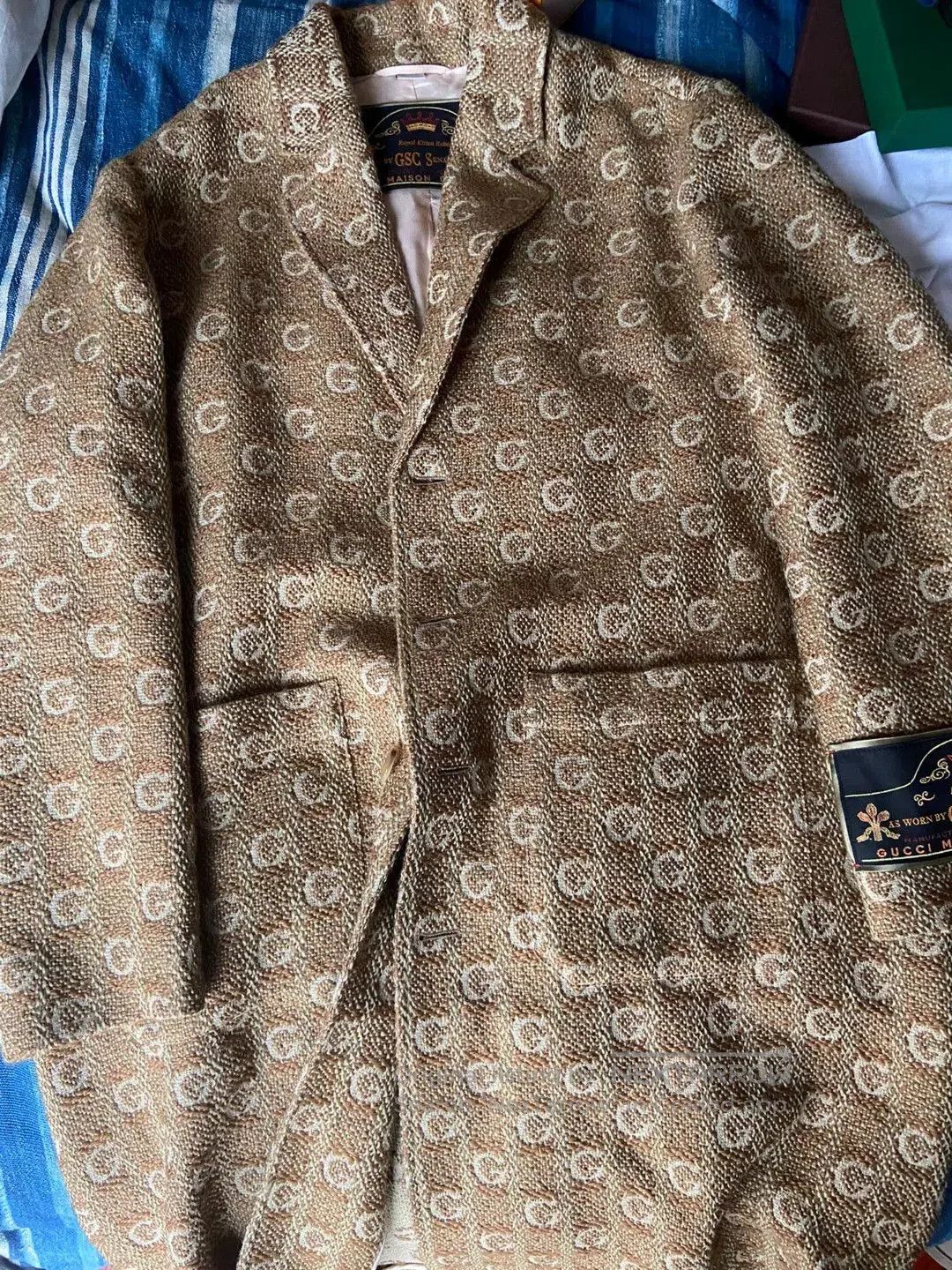 gucci logo embroidered trench coat.