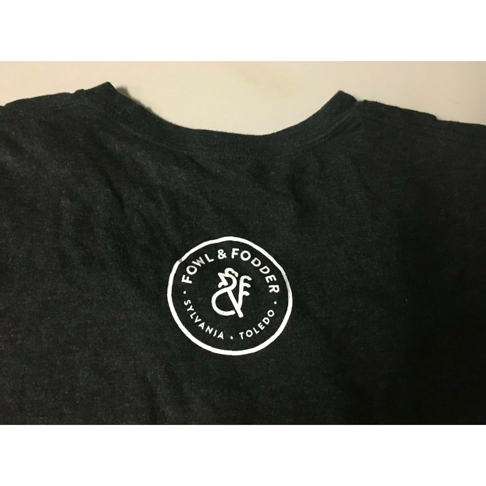 Next Level Fowl & Fodder Eat Local T Shirt Men Medium Black/Gray Next Level 100% Cotton Short Sleeve Restaurants Ohio Sylvania Size US M / EU 48-50 / 2 - 3 Thumbnail
