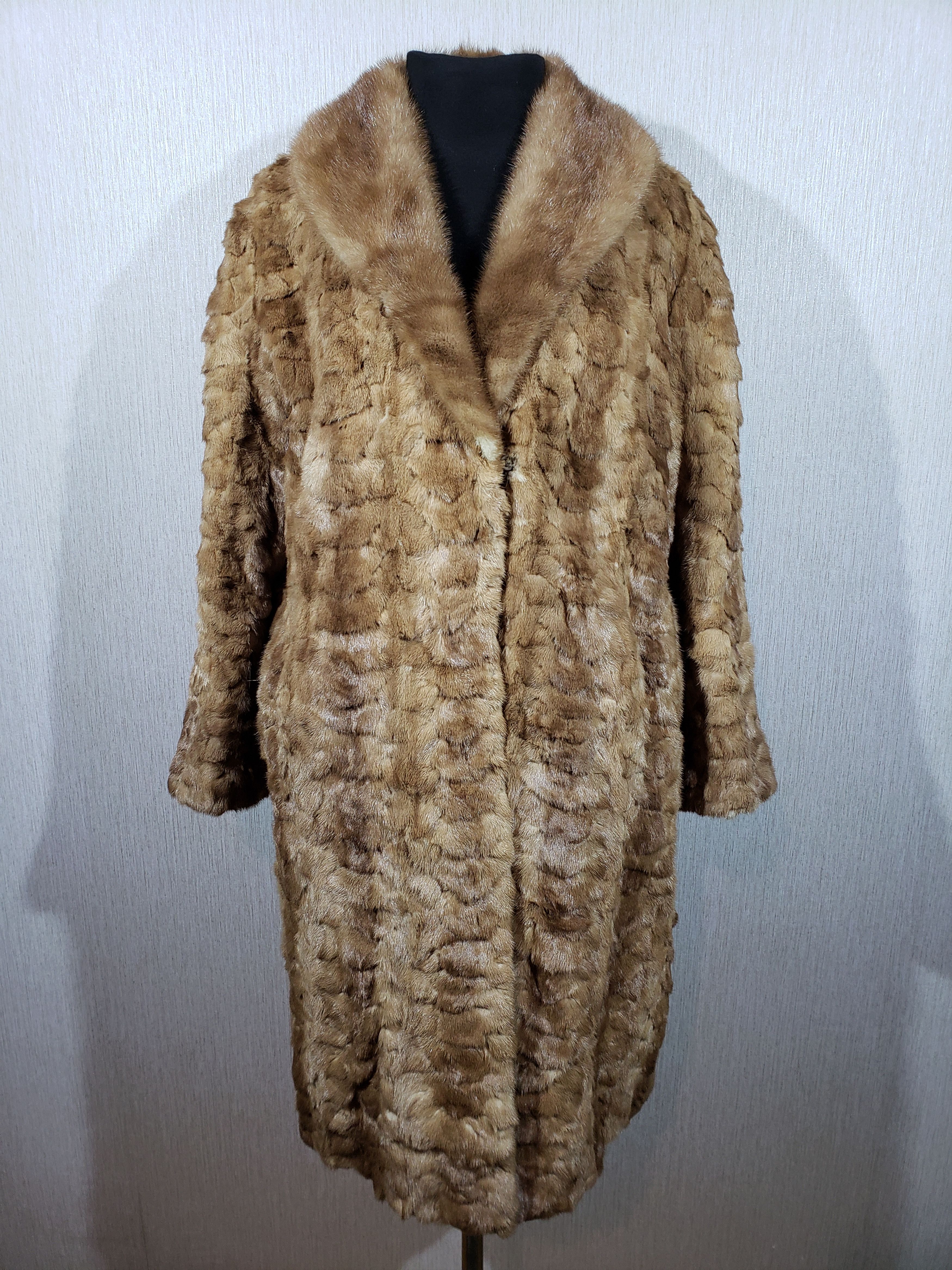 Stylish women's mink fur coat.