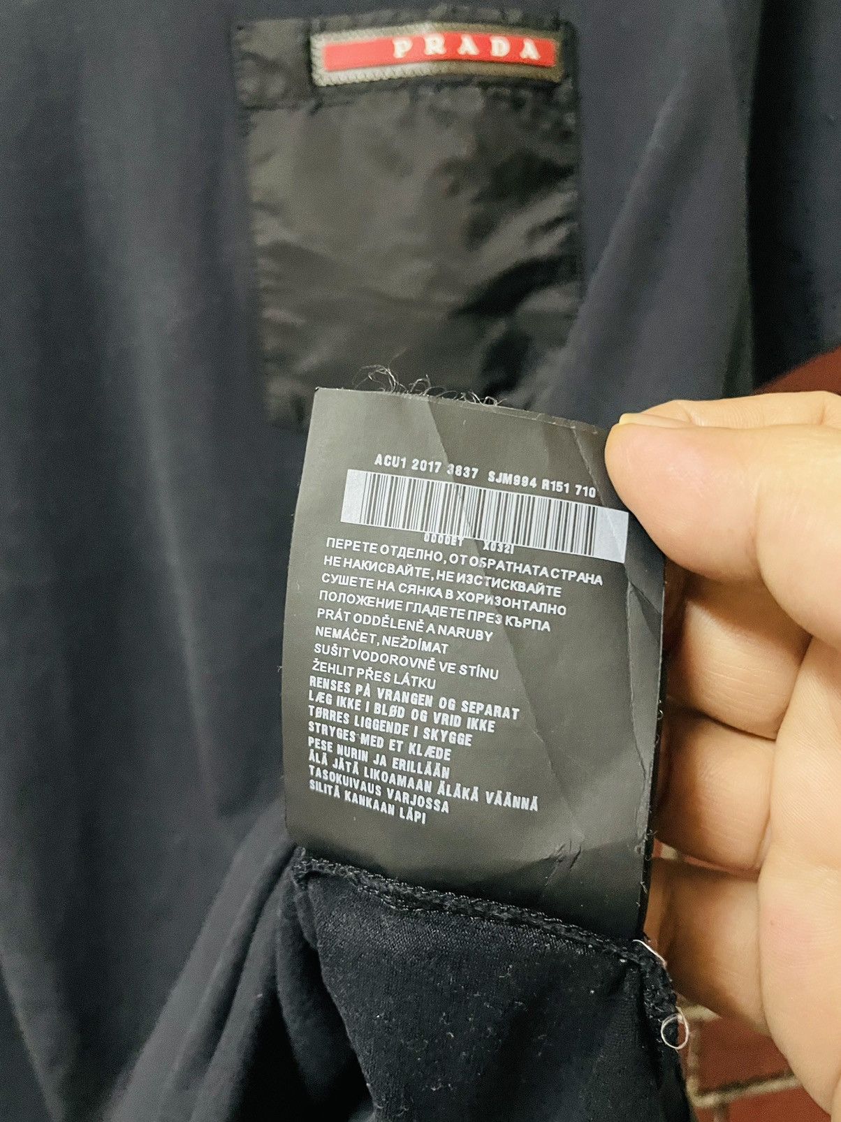 PRADA V NECK RUBBER LOGO SINGLE POCKET SHIRTS