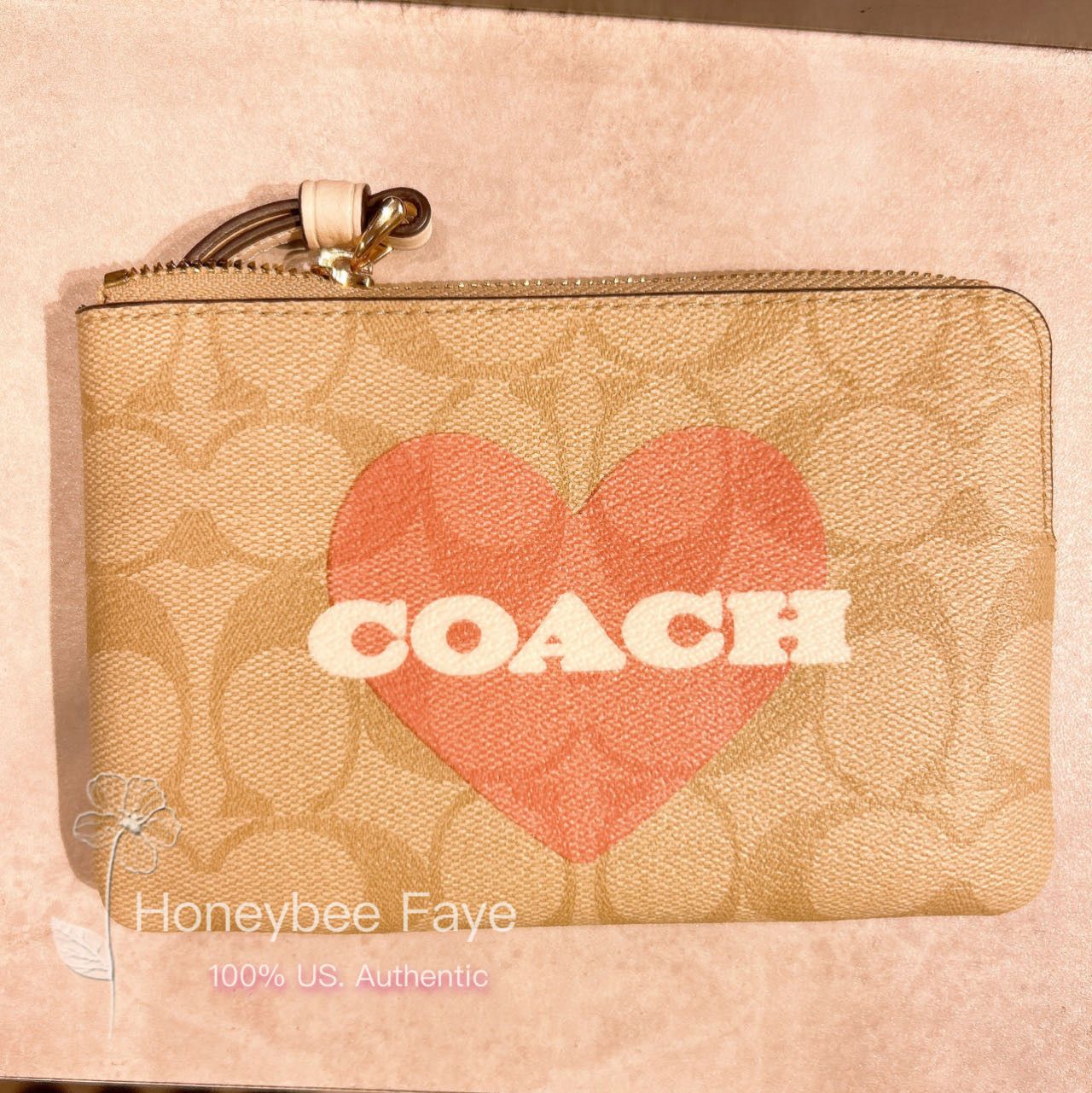 image of Coach Corner Zip Wristlet In Signature Canvas With Heart in Gold, Women's