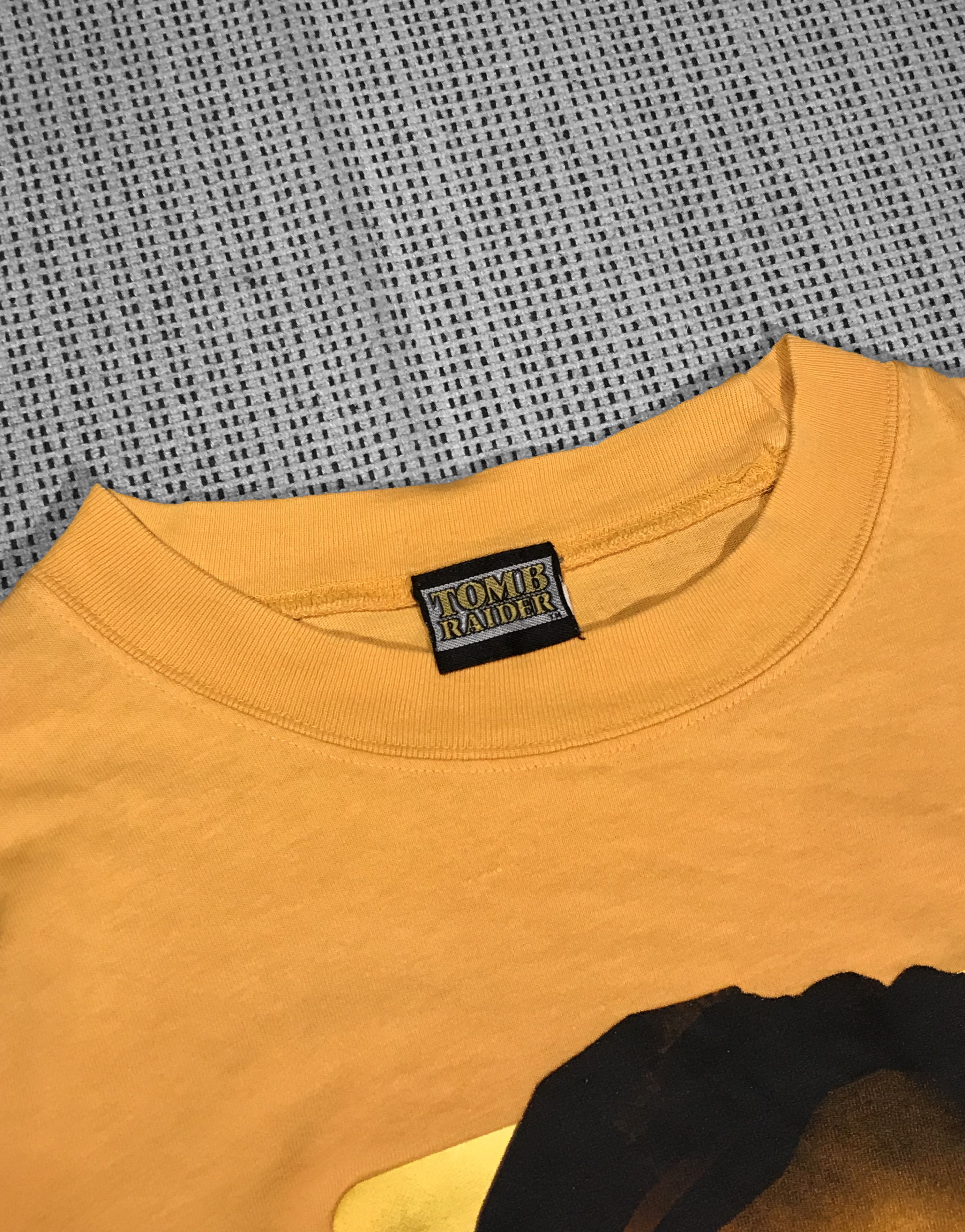 Vintage Vintage yellow T-shirt 1996/2001 Tomb Raider video game (XL) Size US XL / EU 56 / 4 - 4 Thumbnail
