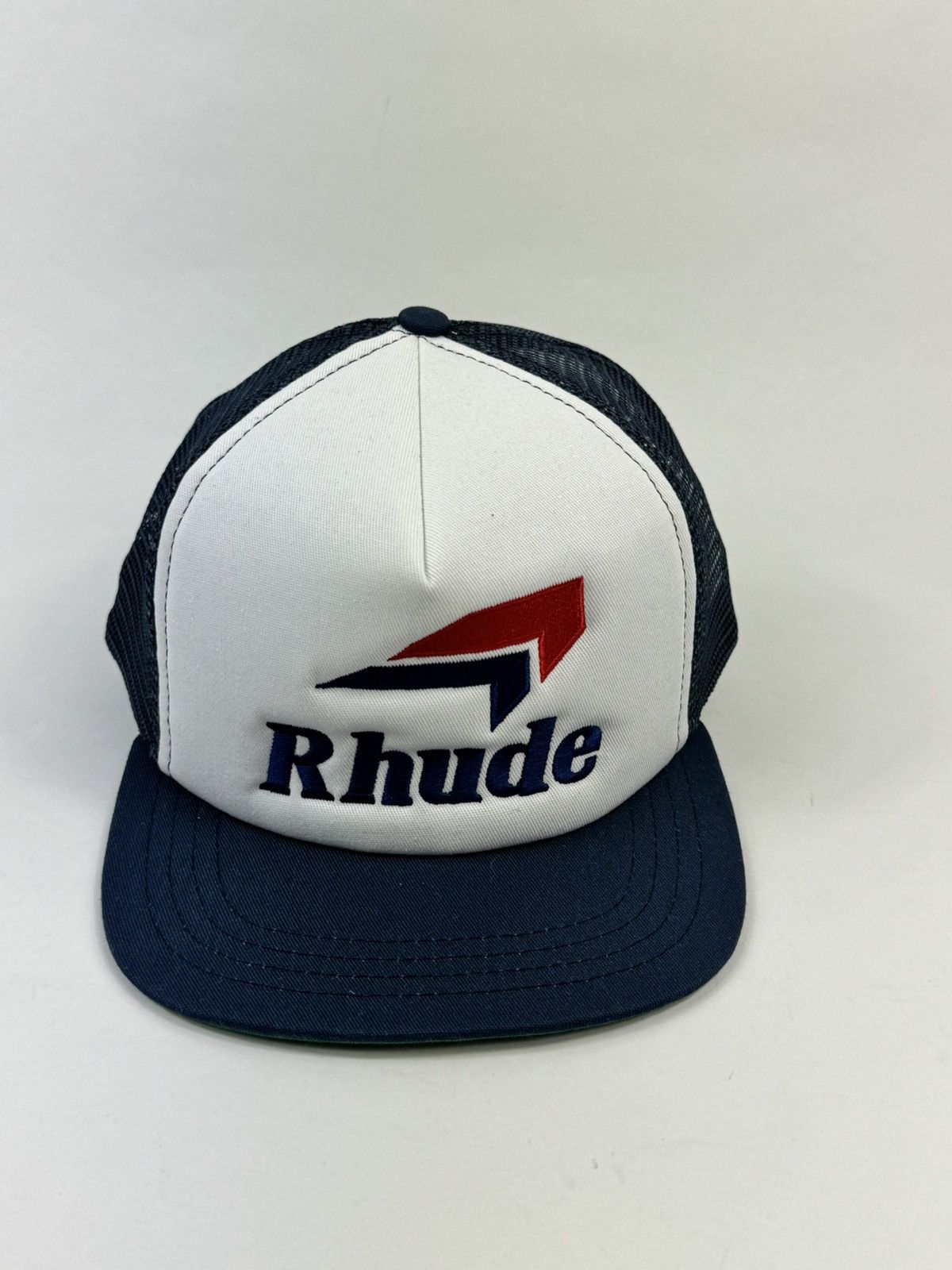 image of Rhude Logo Embroidered Trucker Cap in Navy, Men's