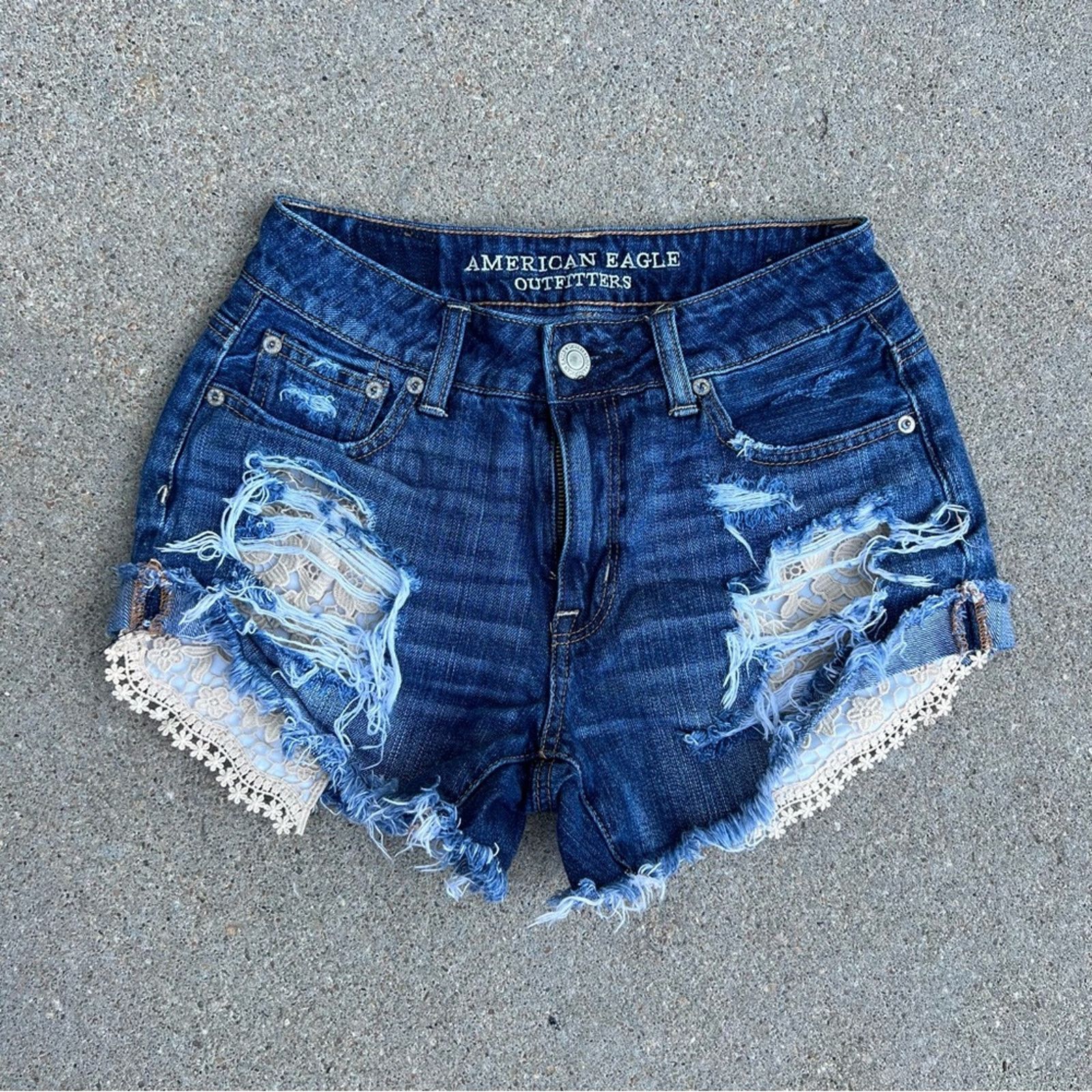 American Eagle Outfitters AEO high rise festival jean shorts peekaboo crochet pockets Size 25" / US 0 / IT 36 - 1 Thumbnail