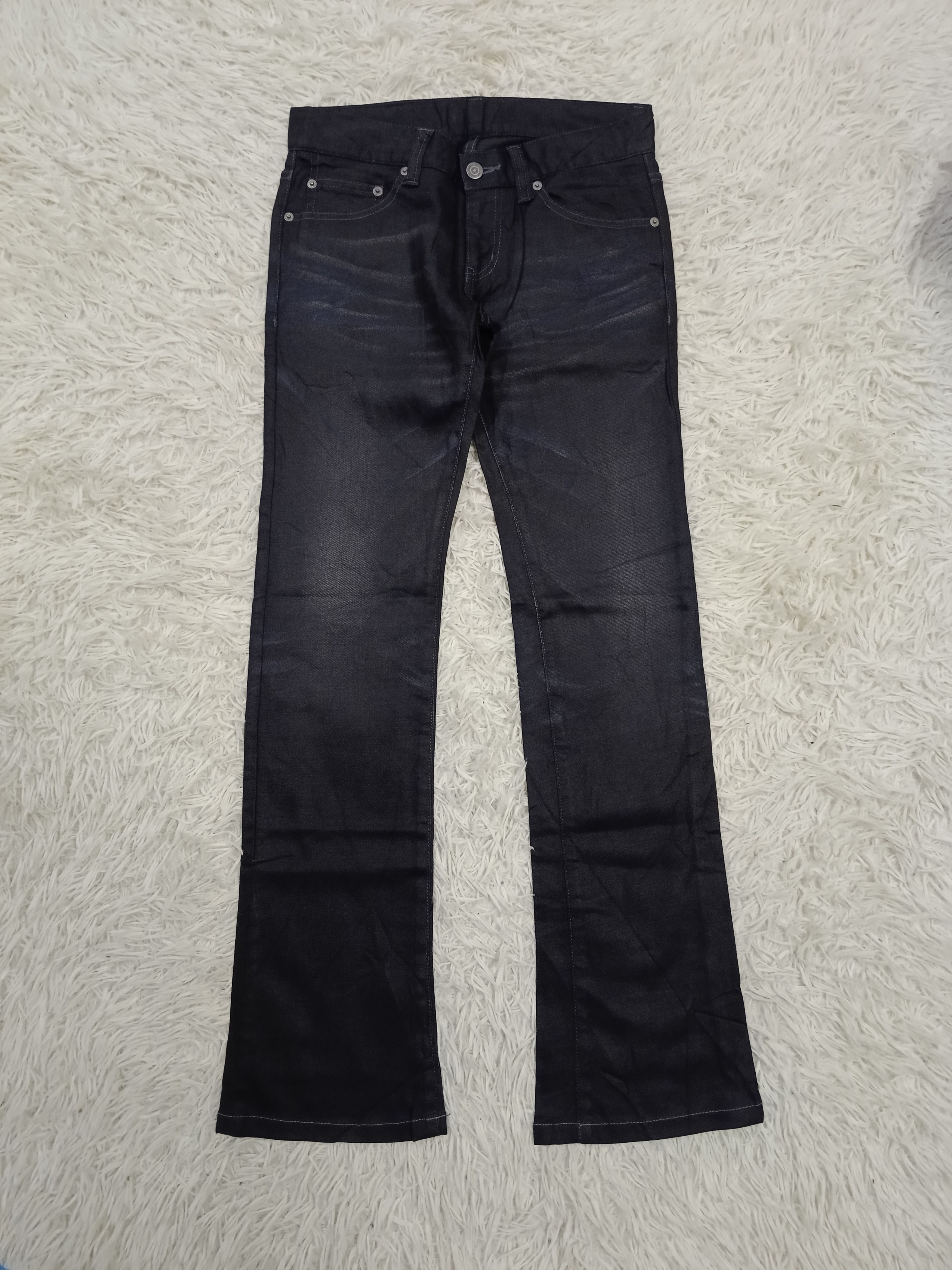 パンツ Tornado Mart waxed flare denim neonblack Tornado Mart Xray Waxed Tribal Embroidery Flared Jeans