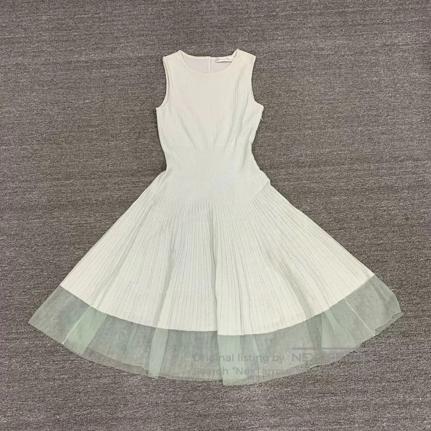 sleeveless long dress by Dior in white.