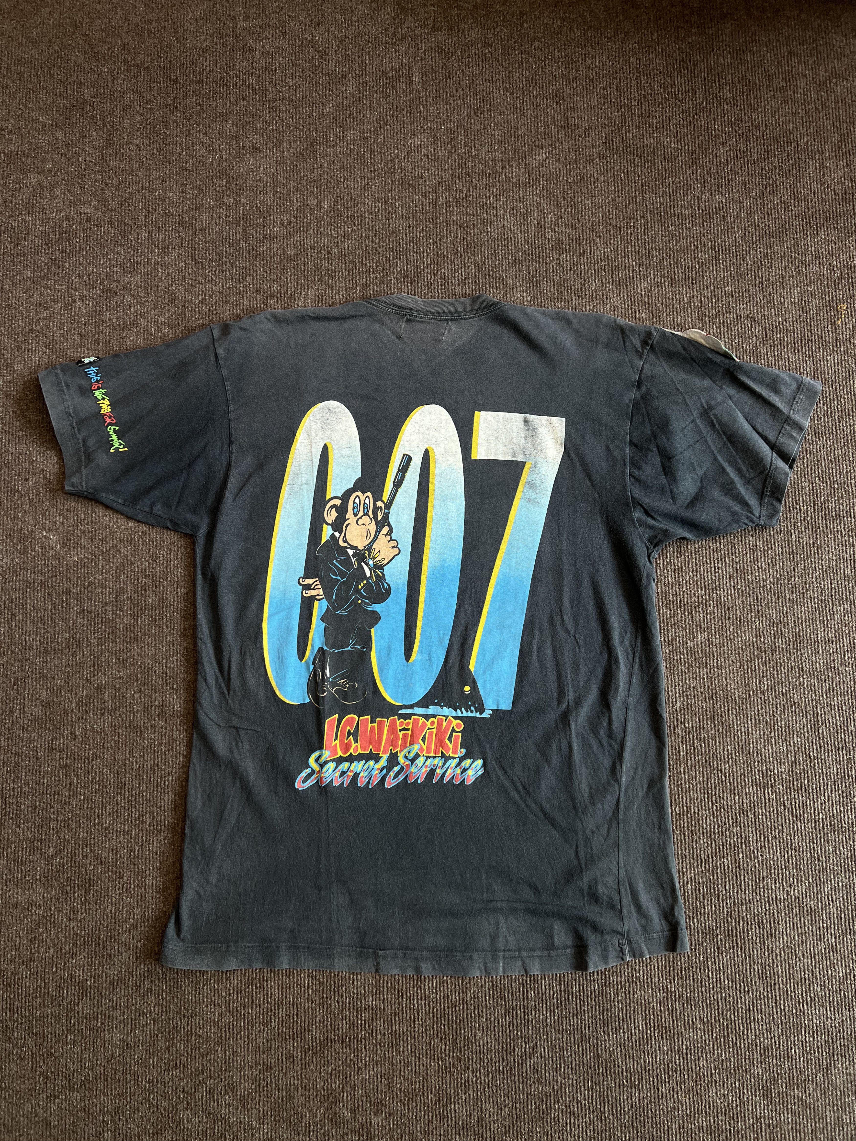 Vintage Vintage 90s L.C. Waikiki Monkey 007 Secret Service T-Shirt Size US XL / EU 56 / 4 - 1 Thumbnail