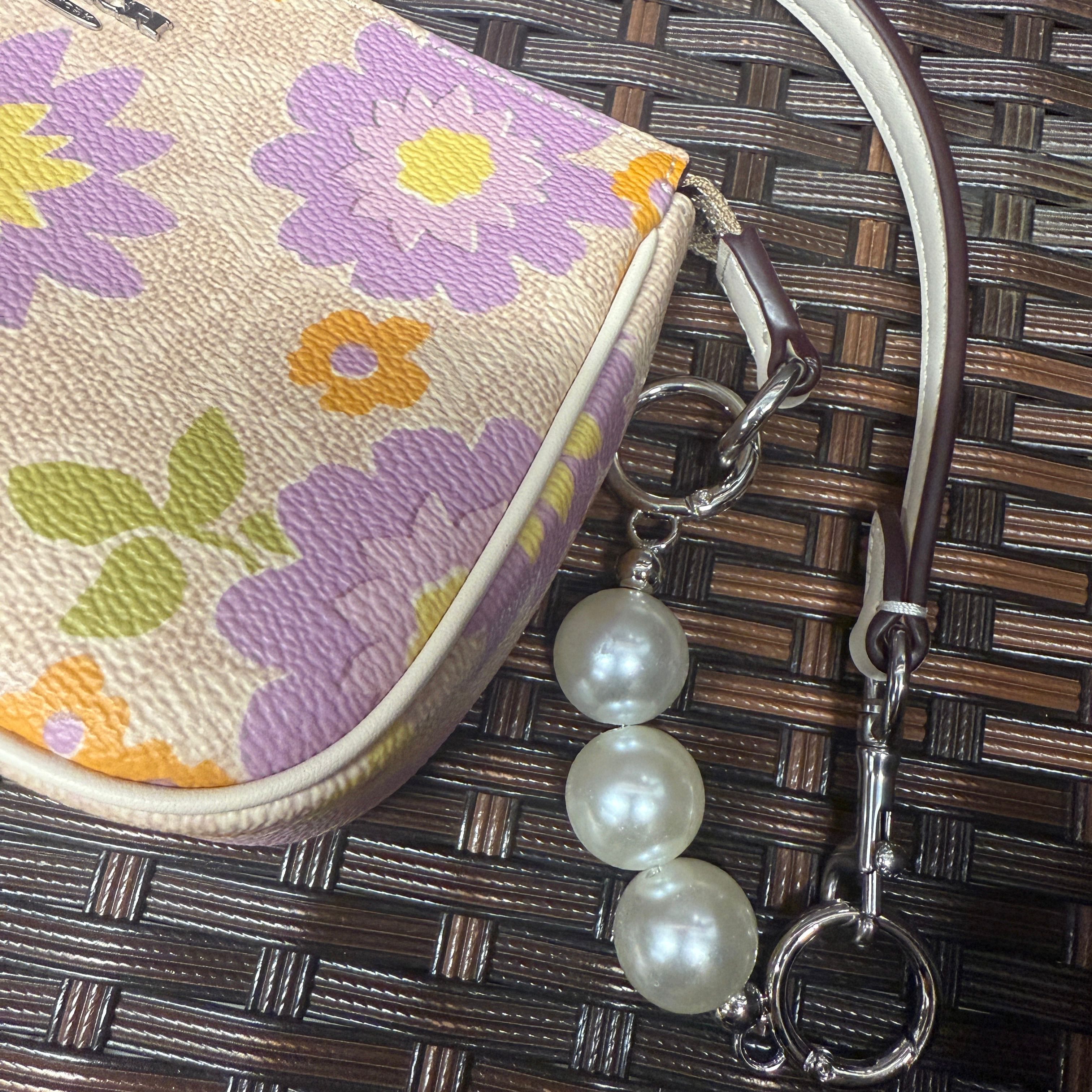 coach Nolita 19 In Signature Canvas With Floral Print cbm73
