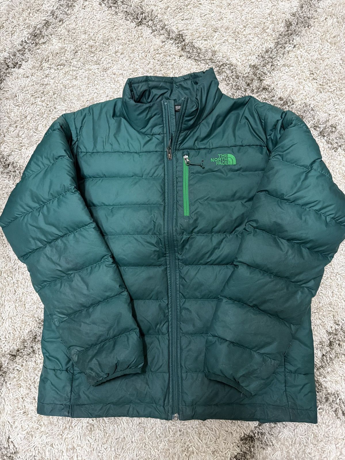 The north face green puffy jacket