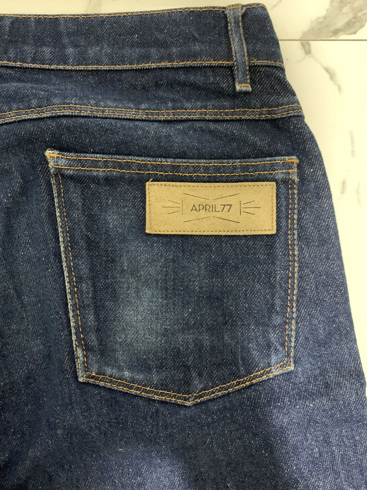 April 77 × Levi