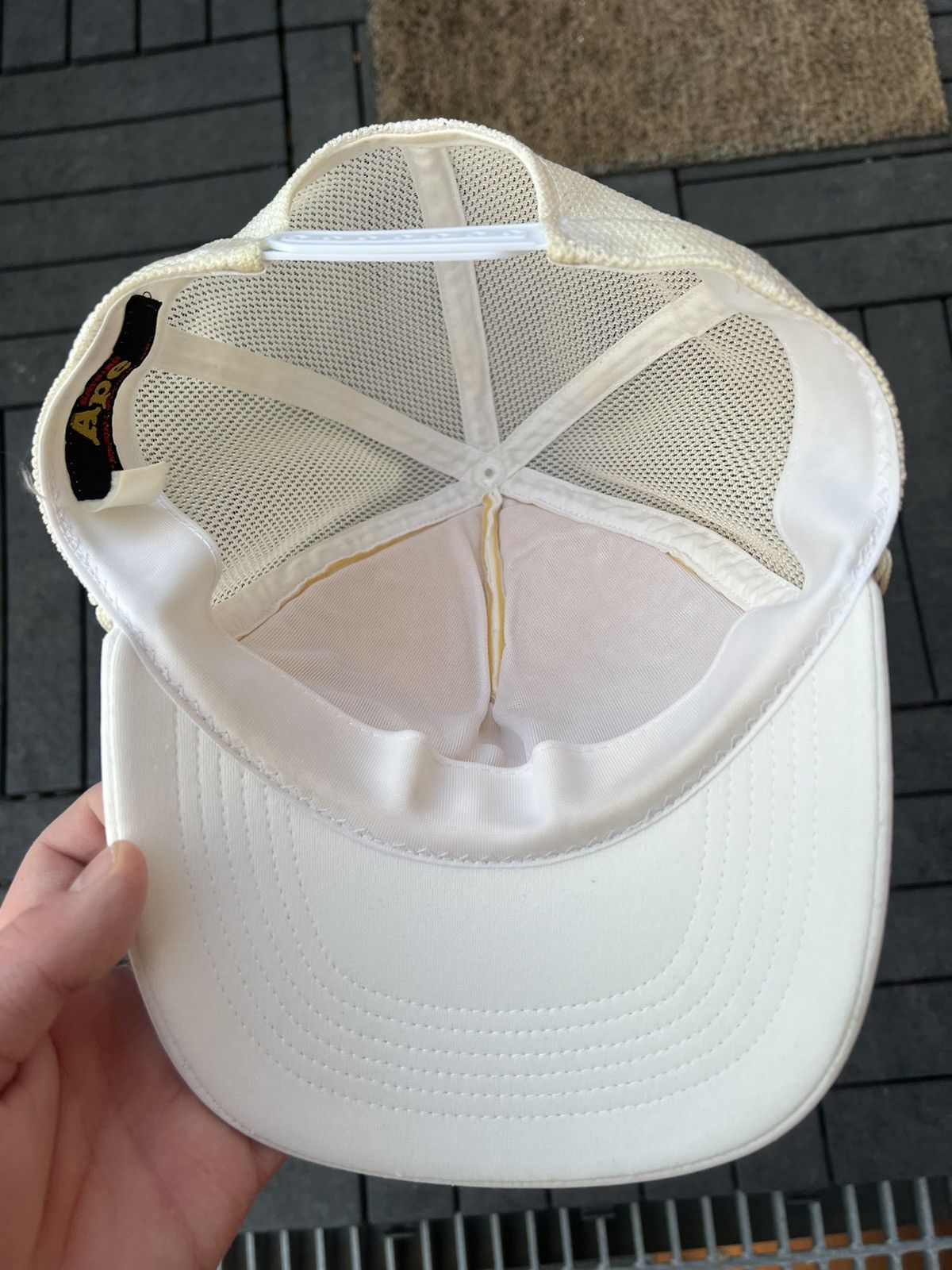 Bape × Swarovski 2006 Bape x Swarovski KISS Logo Trucker Hat White Size ONE SIZE - 7 Thumbnail