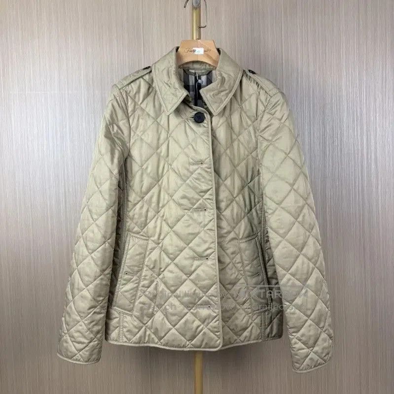 Burberry Quilted Beige Polyester Women's Jacket.