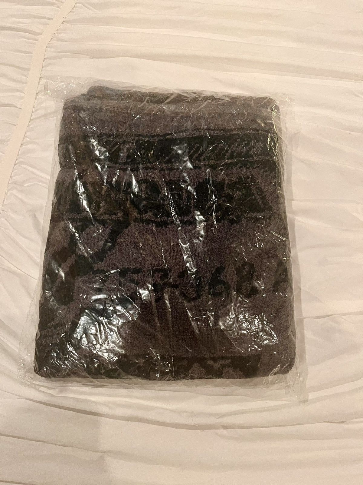 image of Kaws Originally Fake Sinking Dollar Beach Towel in Black, Men's