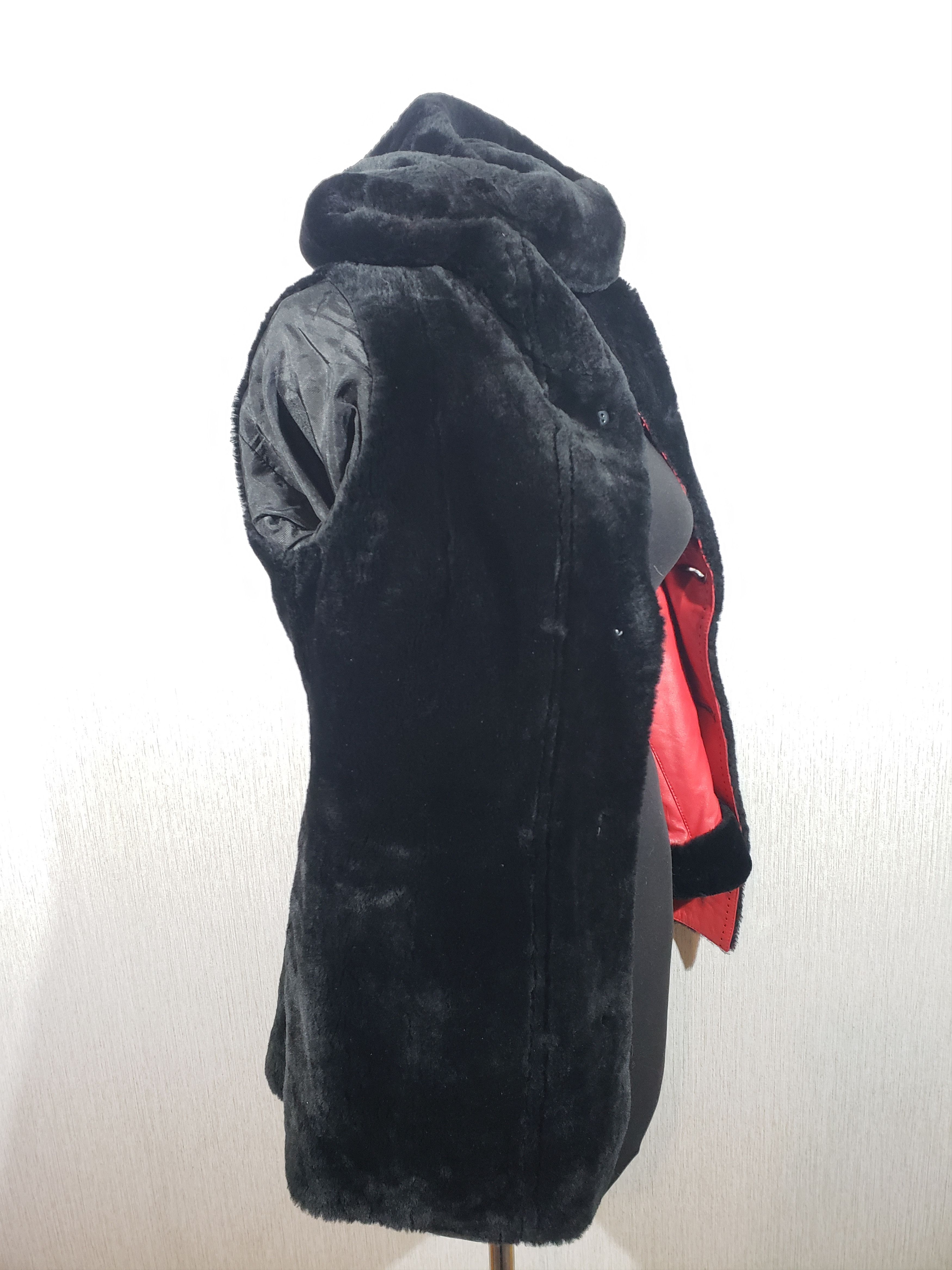Stylish women's red sheepskin coat with a hood. Fur Faux Fur