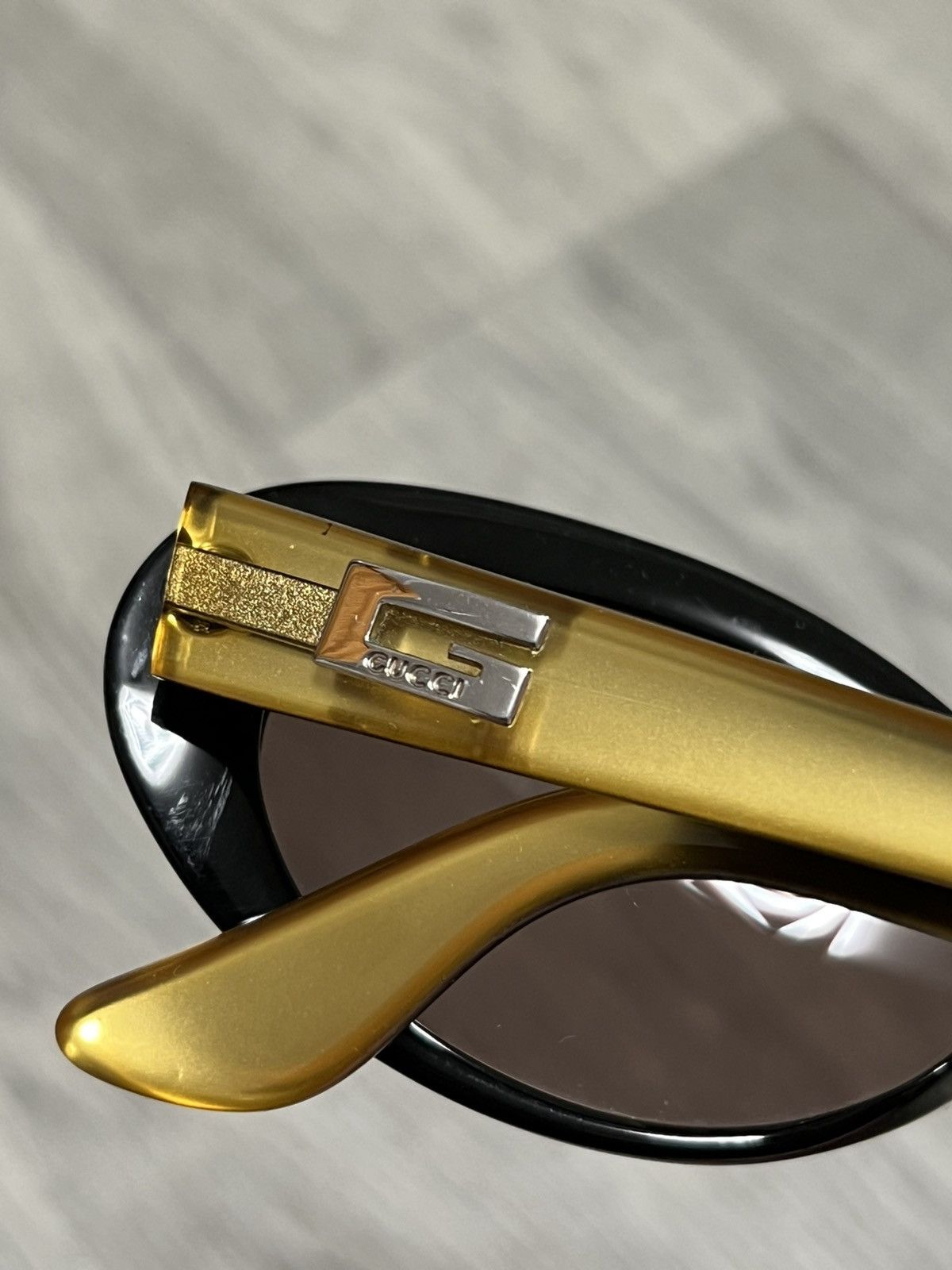 Vintage Gucci Vintage gold sunglasses with black inner temples Size ONE SIZE - 18 Thumbnail