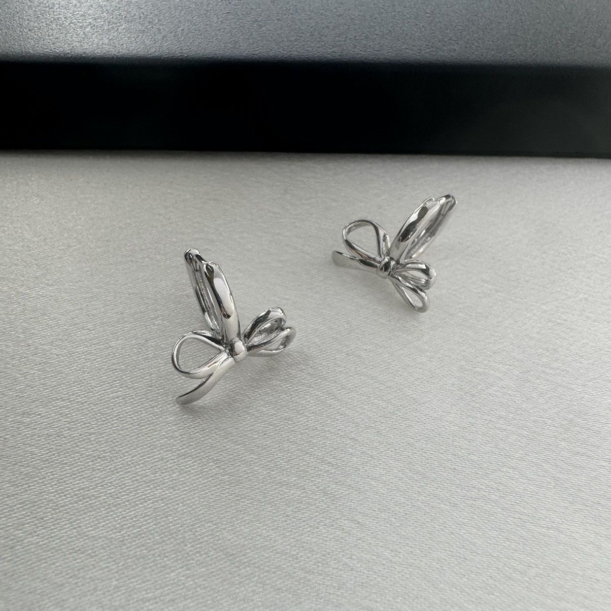 Designer Huggie Bow Silver Hoop Earrings for Women Size ONE SIZE - 2 Thumbnail